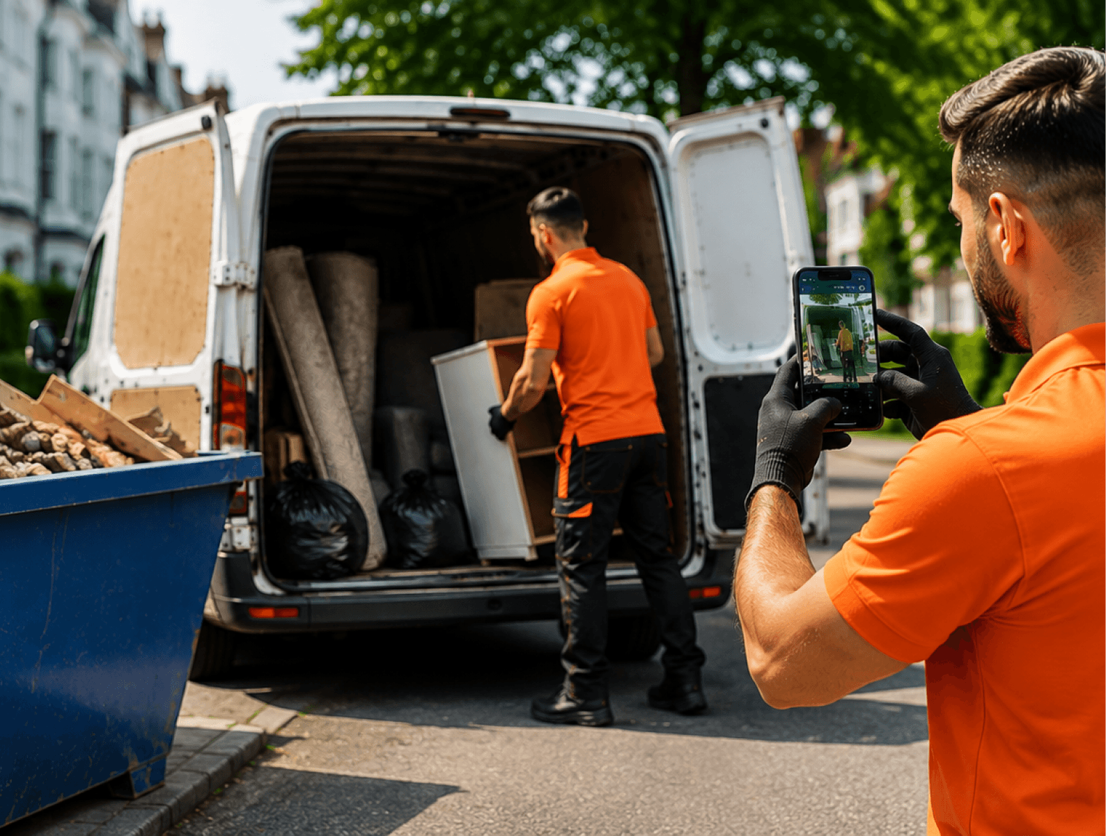 Customer photographing rubbish for a WhatsApp quote while the crew loads a van