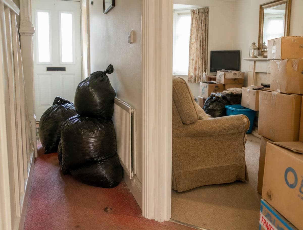 Household bags and boxes ready for rubbish clearance